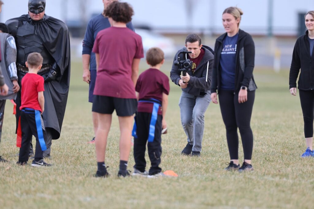 communication team photographing football game