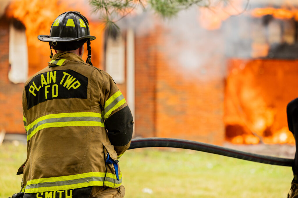 Fire fighter putting out a fire