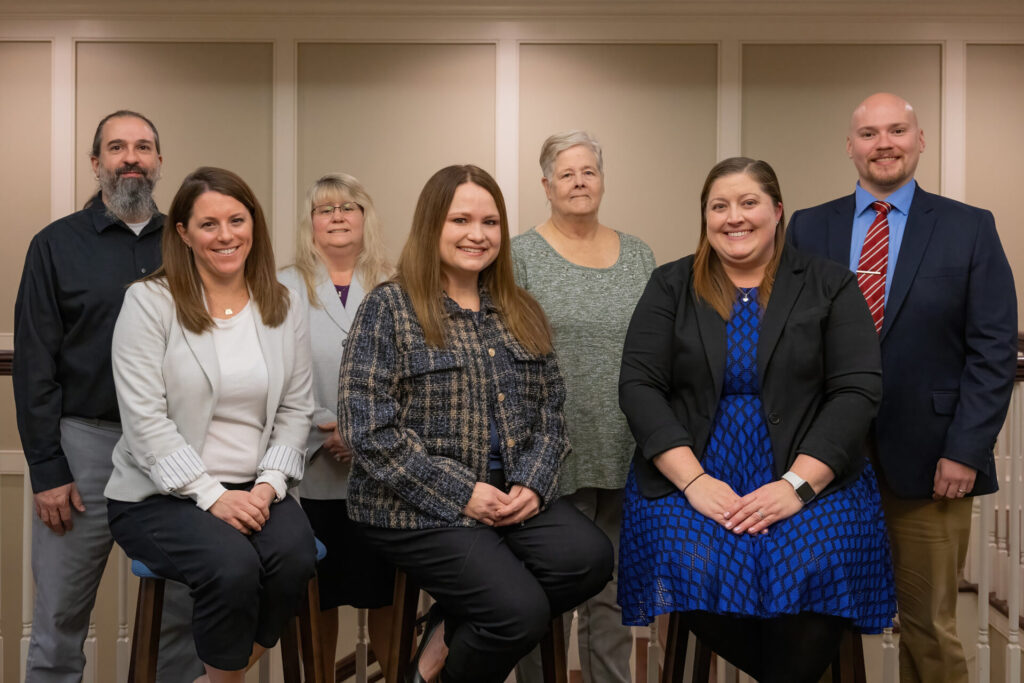 finance team posing for a picture