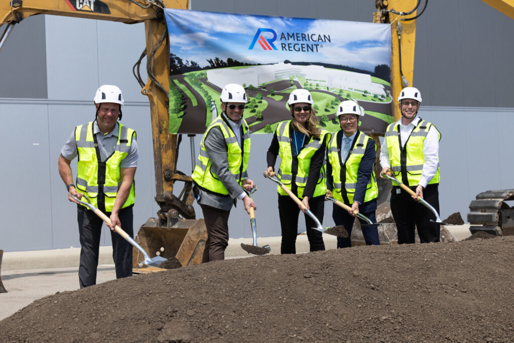 American Regent officials and New Albany Mayor Sloan Spalding take part in a ceremonial groundbreaking