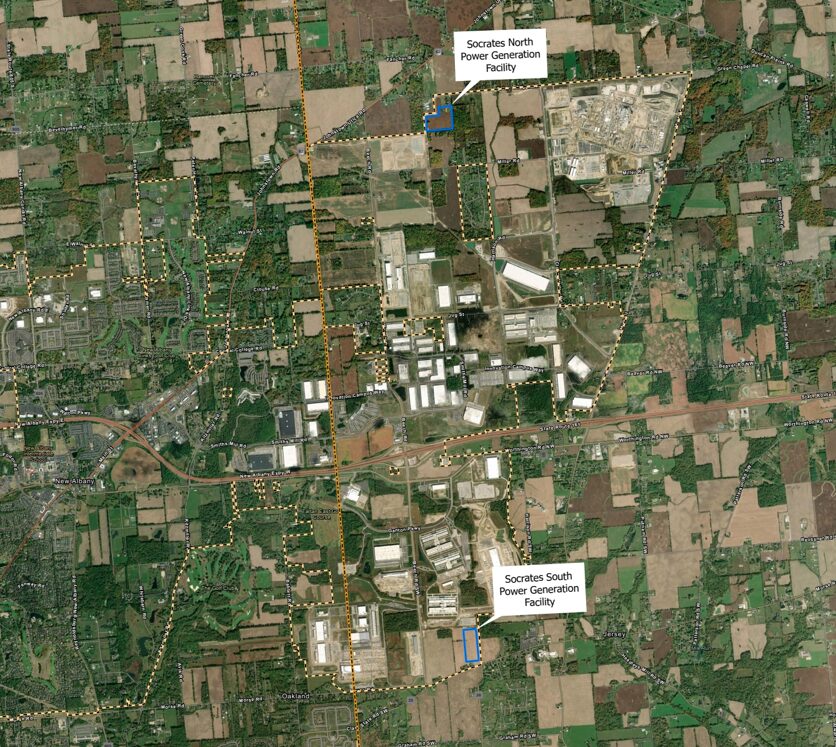 Aerial view of a rural area with two labeled sites: Socrates North Power Generation Facility near the top center and Socrates South Power Generation Facility towards the bottom right. The landscape includes agricultural fields, scattered housing, and industrial buildings.