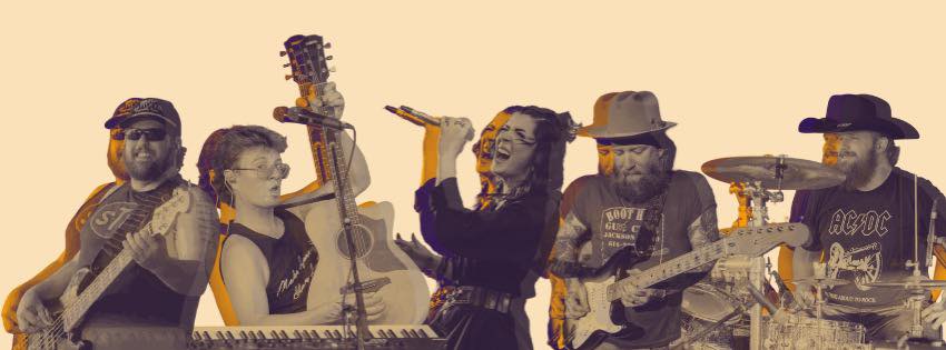 Five-piece band: bassist, keyboardist with acoustic guitar, female lead singer, bearded electric guitarist, and drummer.