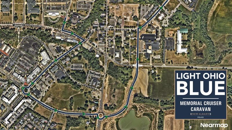 Aerial map showing a planned parade route through a town with marked roundabouts, green route lines, parks, and a dark blue box reading "Light Ohio Blue Memorial Cruiser Caravan."