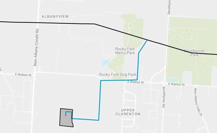 Stylized map showing a blue route from a shaded polygon in the southwest to Rocky Fork Metro Park and E Walnut St in the northeast.